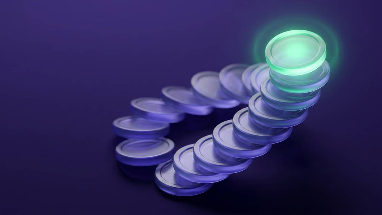 A column of rounded glass coins rising on a deep violet background, with emerald light on the top coin